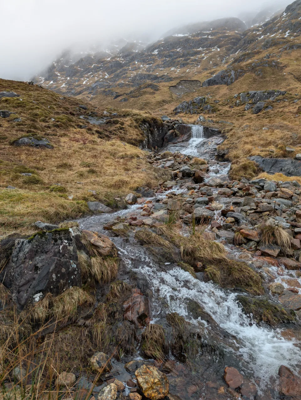 Burn cascading over rock steps