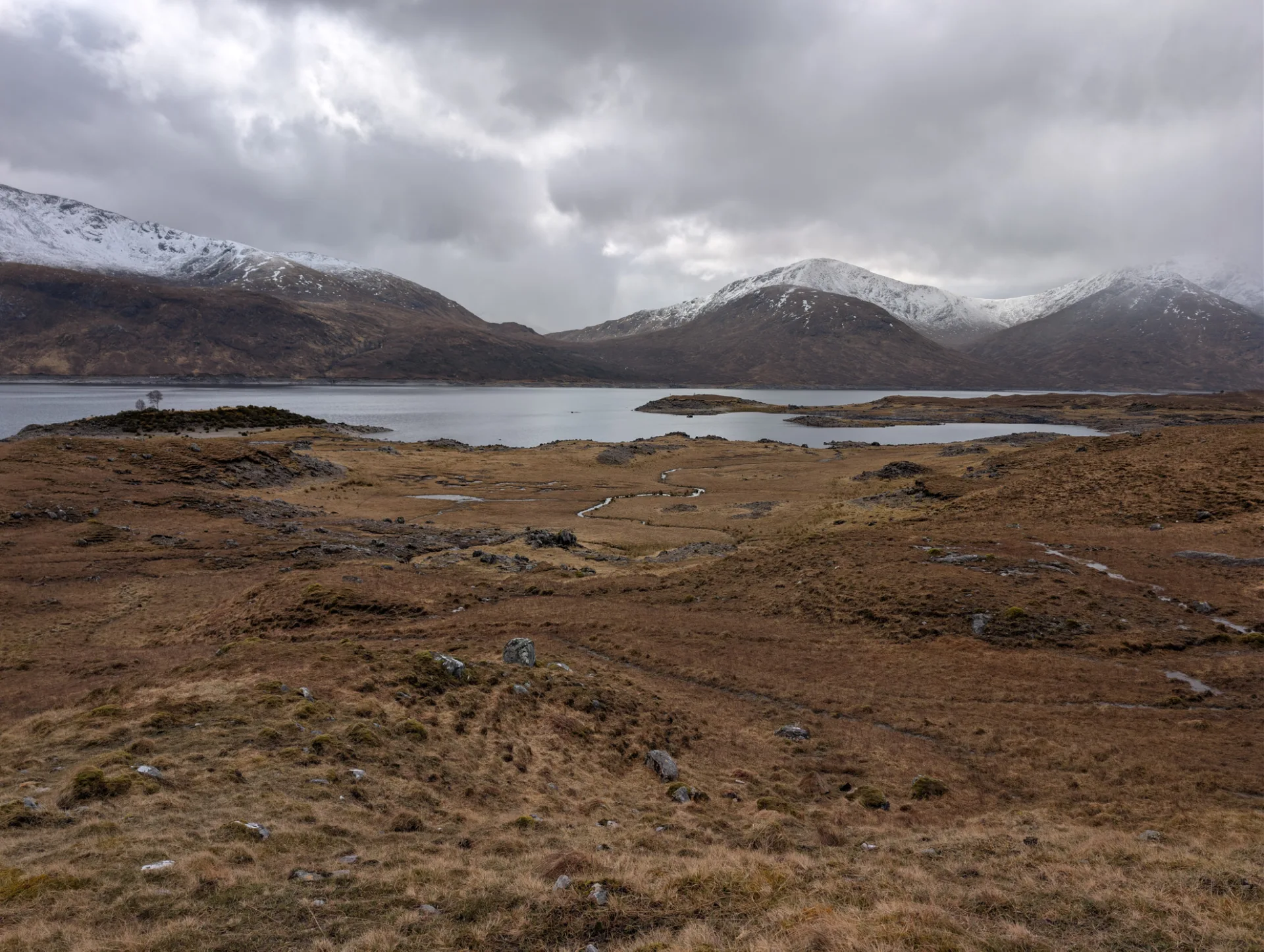 Wide moor in front of the snow-covered peaks