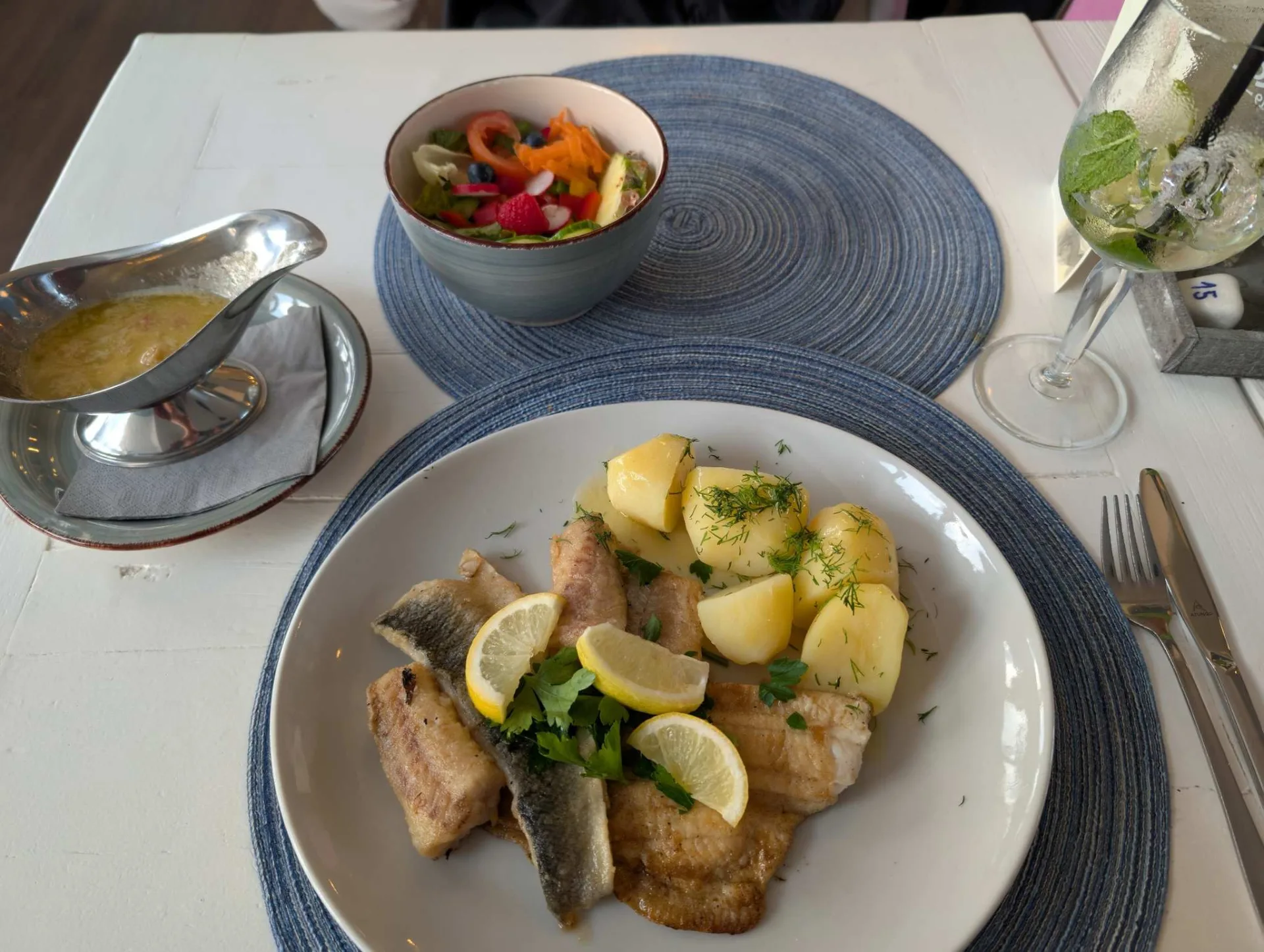 Island fare: fried fish with boiled potatoes, dill and lemon, salad and melted butter.