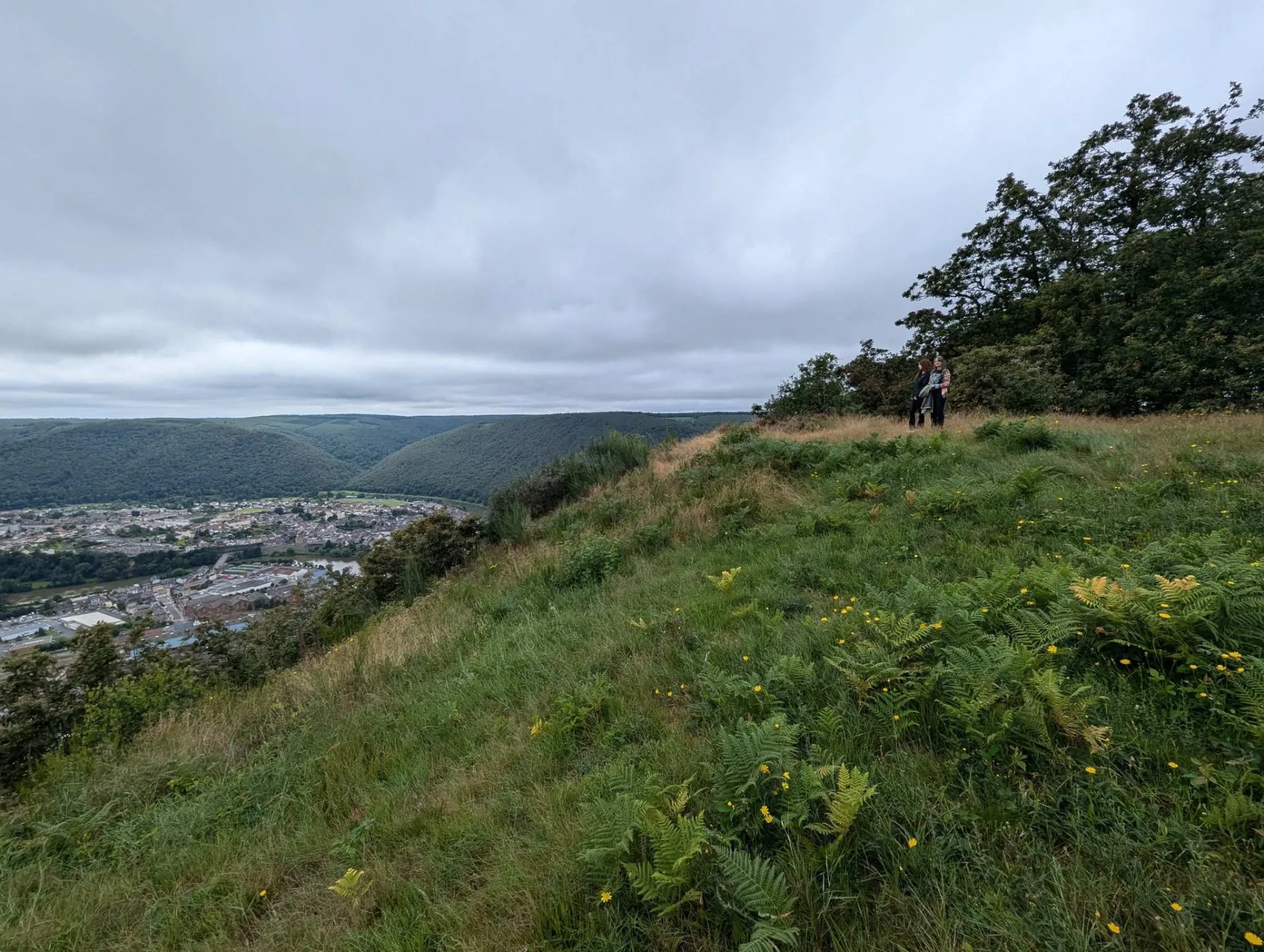 Above the Meuse valley, the view opens onto Revin, deep down in the river bend.
