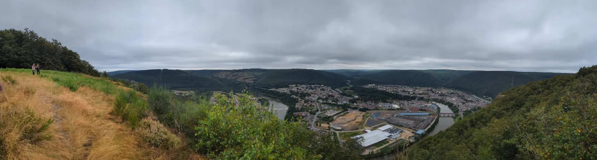 The panorama over the Meuse loop at Revin — the town all but encircled by the river.