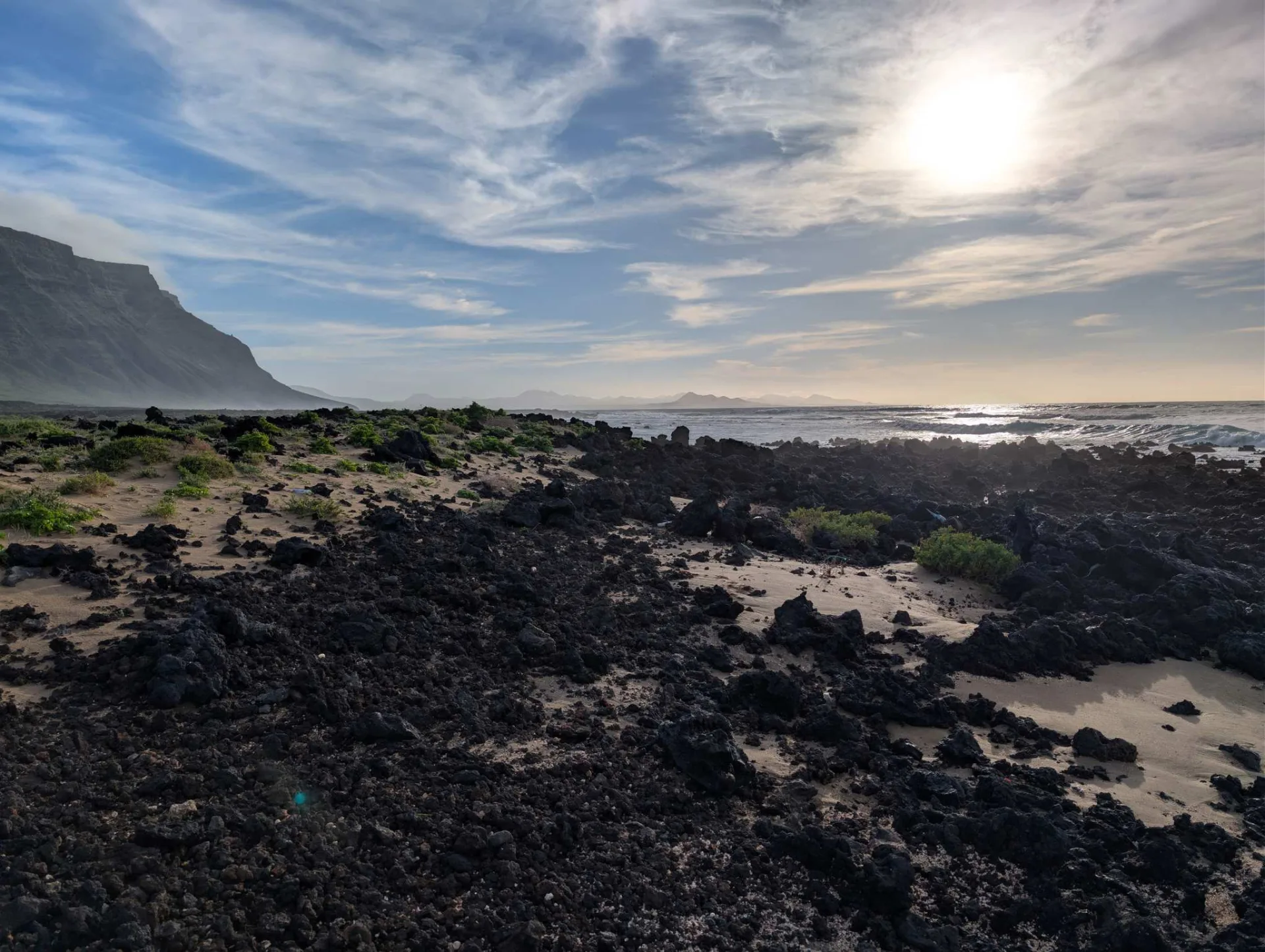 The long clifftop ridge in the backlight.