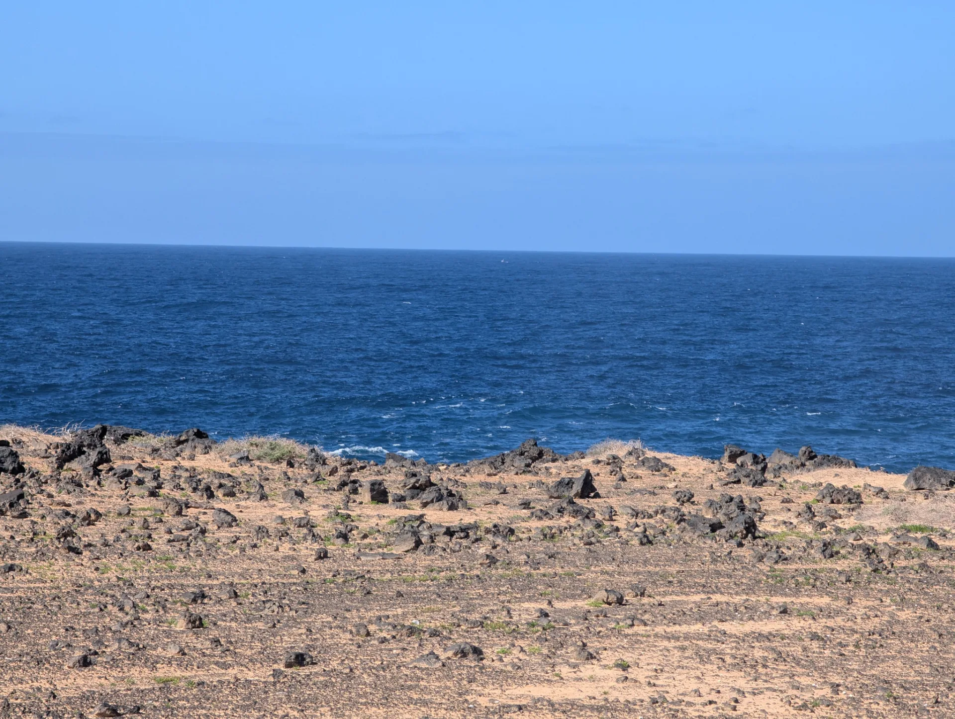Sandy tracks and deep-blue sea on the car-free neighbouring island.