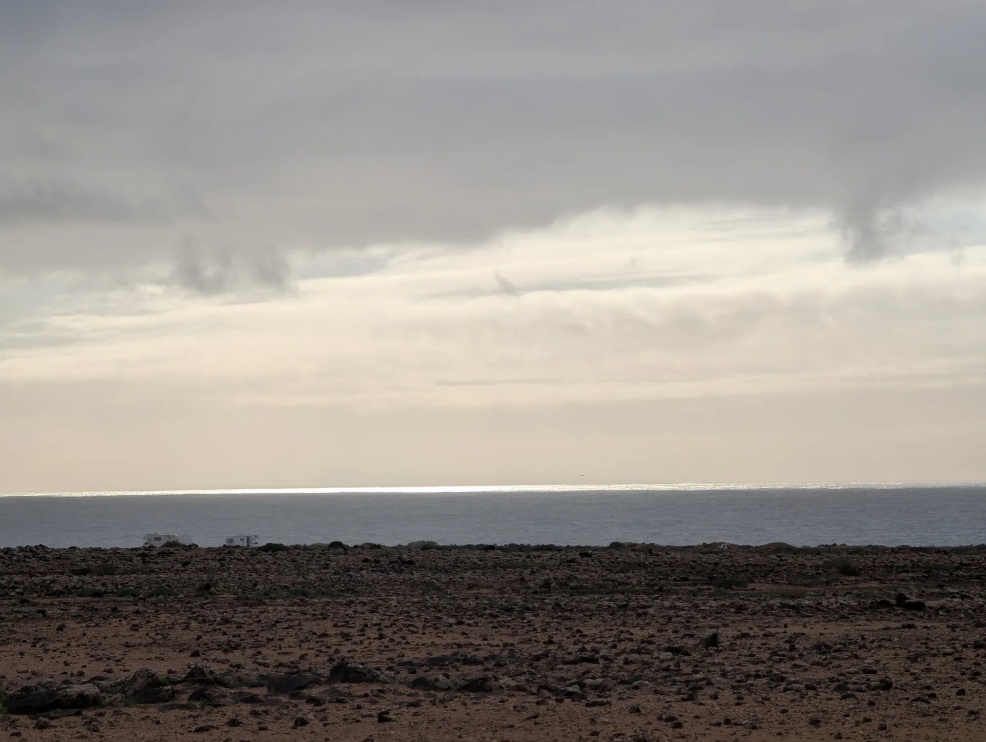 Deep dusk; the lava plain loses its colour.
