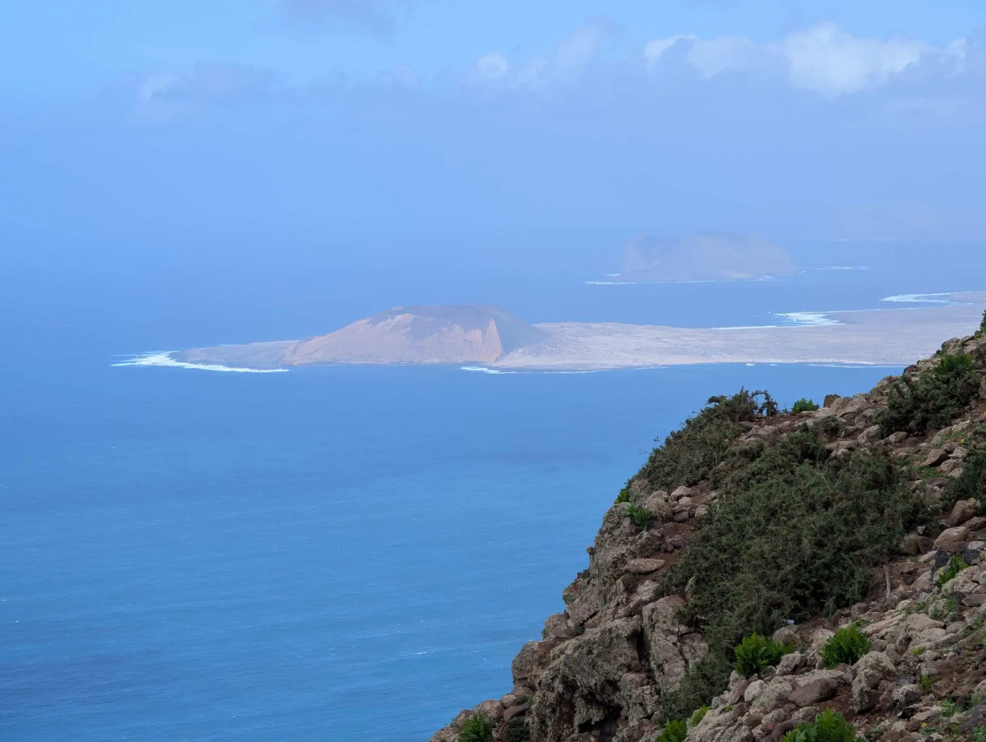Once more the plunging view from the cliff edge to the turquoise sea.