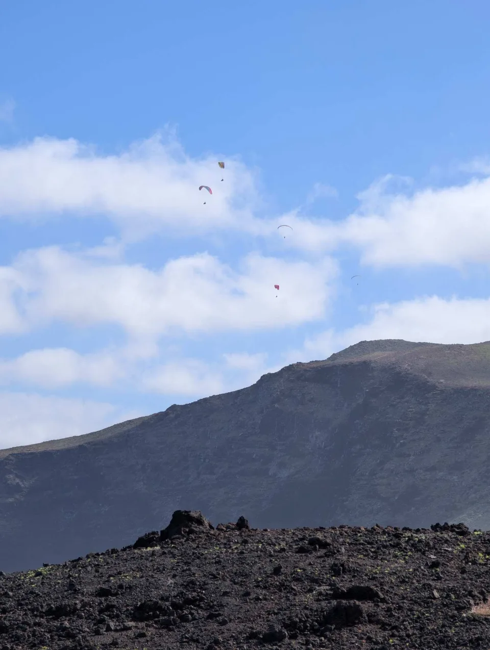 A dark volcanic cone above the lava field near Tenésar.