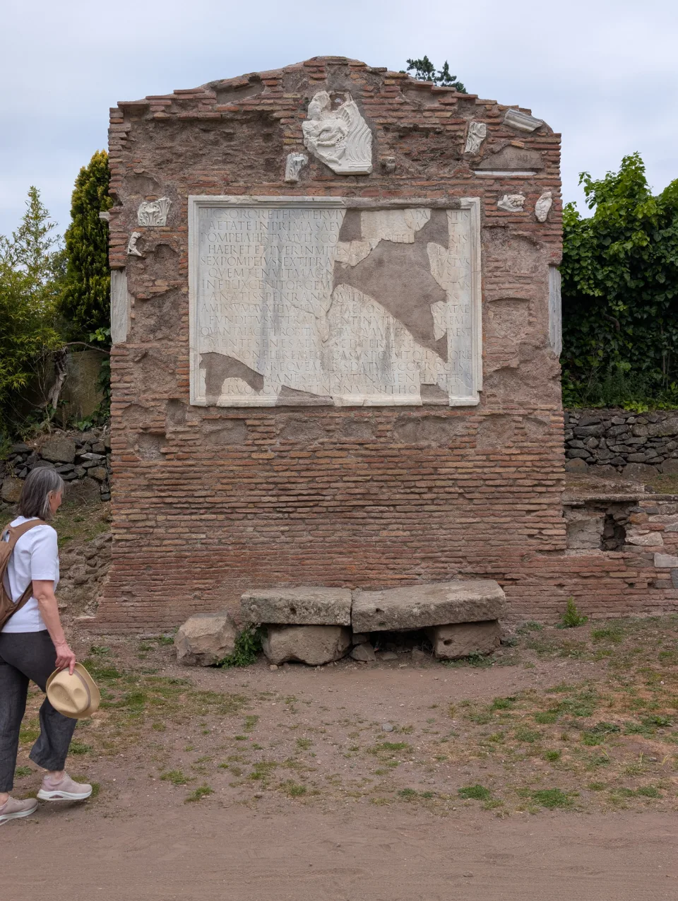 Ancient tomb monument with marble plaque