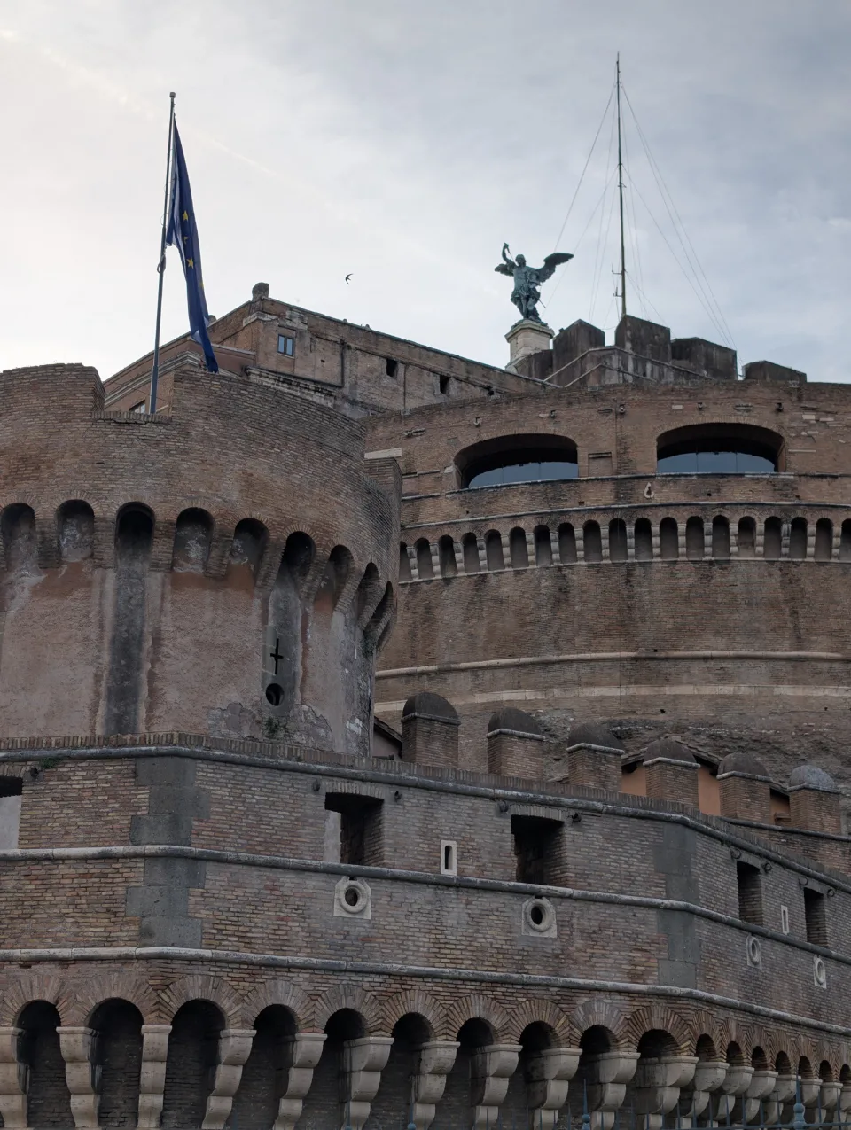 Castel Sant'Angelo from the front with angel statue and EU flag