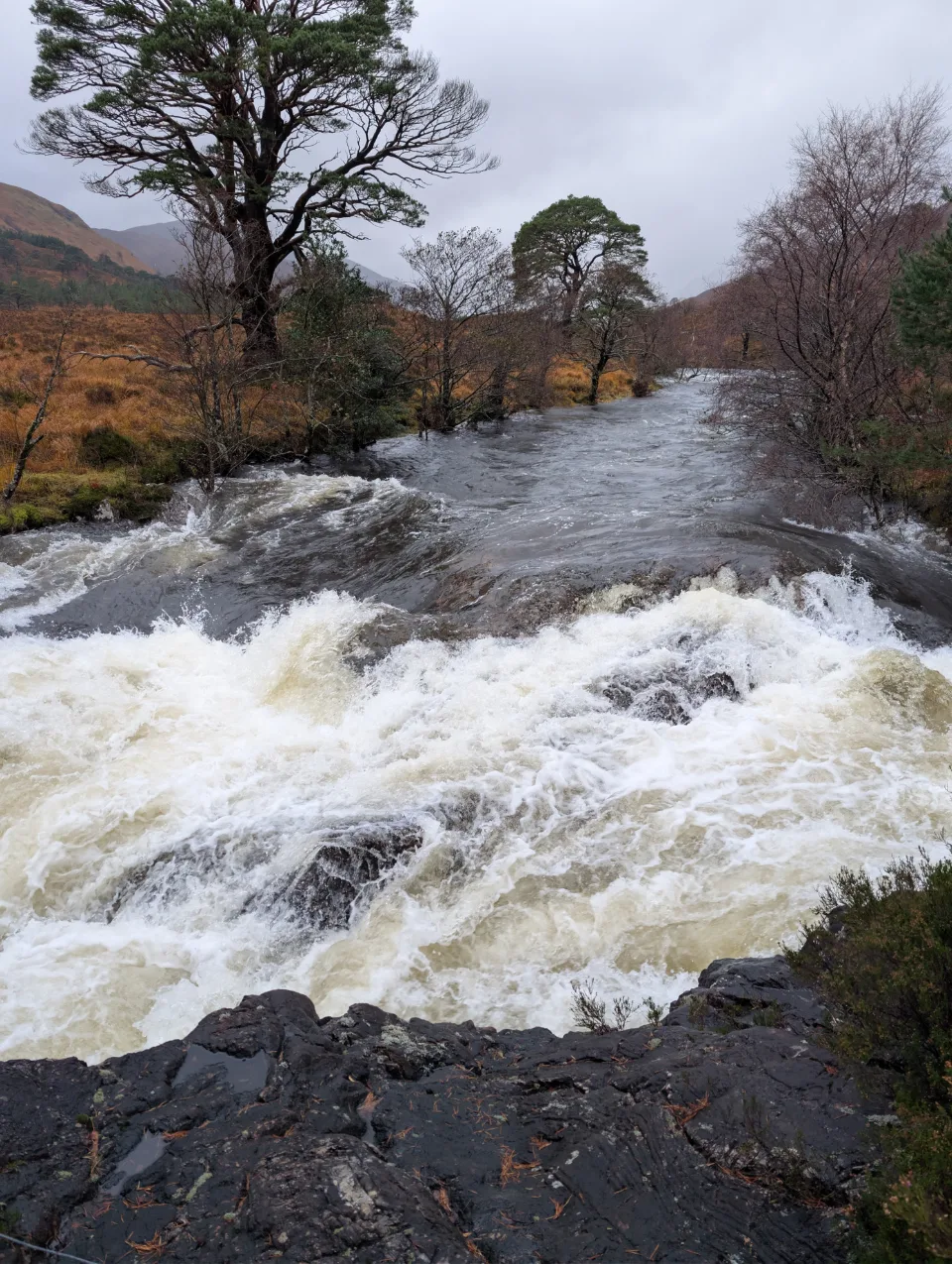 Roaring waterfall — powerful water over rock steps